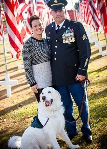 Douglas and Britnee Kinard with service dog Gunner.