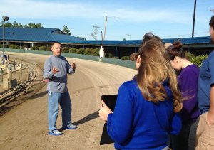 Students on the track learn about racing from Southland Park Director of Racing Shane Bolender. Photo by Cary Greenwood.