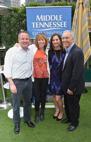 MTSU alum Pete Fisher (left), general manager of the Grand Old Opry, joins Erika Nichols, general manager of Nashville's Bluebird Cafe (second from left) and Ken Paulson, dean of the College of Mass Communication (right), in congratulating MTSU alumna Alicia Warwick, executive director of The Recording Academy's Nashville chapter. MTSU photo by Andrew Oppmann.