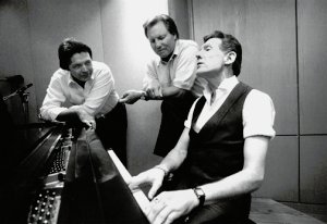 Jerry Lee Lewis playing piano with cousins Mickey Gilley (left) and Jimmy Swaggart. Photo by Chris Harris.