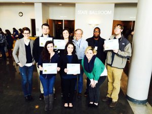 Students hold some of the awards earned at the Southeast Journalism Conference. Front row, from left: Maranda Faris, Dylan Aycock and Laurel O’Neill. Back row, from left: Meagan White, Conner Grott, Samantha Hearn, Leon Alligood (faculty adviser), Greg French and John Connor Coulston.