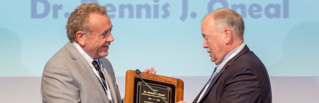 Dr. Dennis Oneal (right) receives the highest honor from the Tennessee Association of Broadcasters.